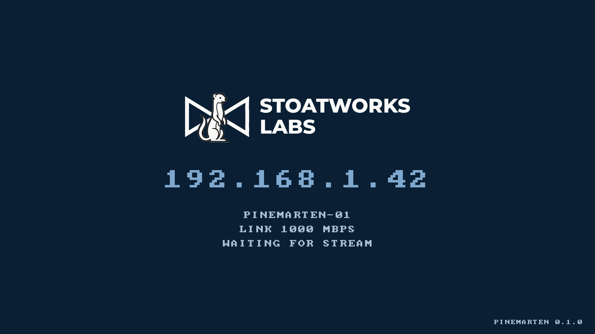 PineMarten boot splash: Stoatworks Labs logo on navy, the IP address 192.168.1.42 beneath it, and hostname, link speed and waiting-for-stream status lines